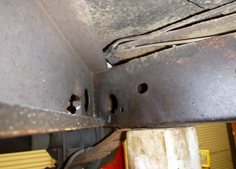 1964 Mercury Monterey - Rusted frame and suspension components visible from underneath a vehicle.