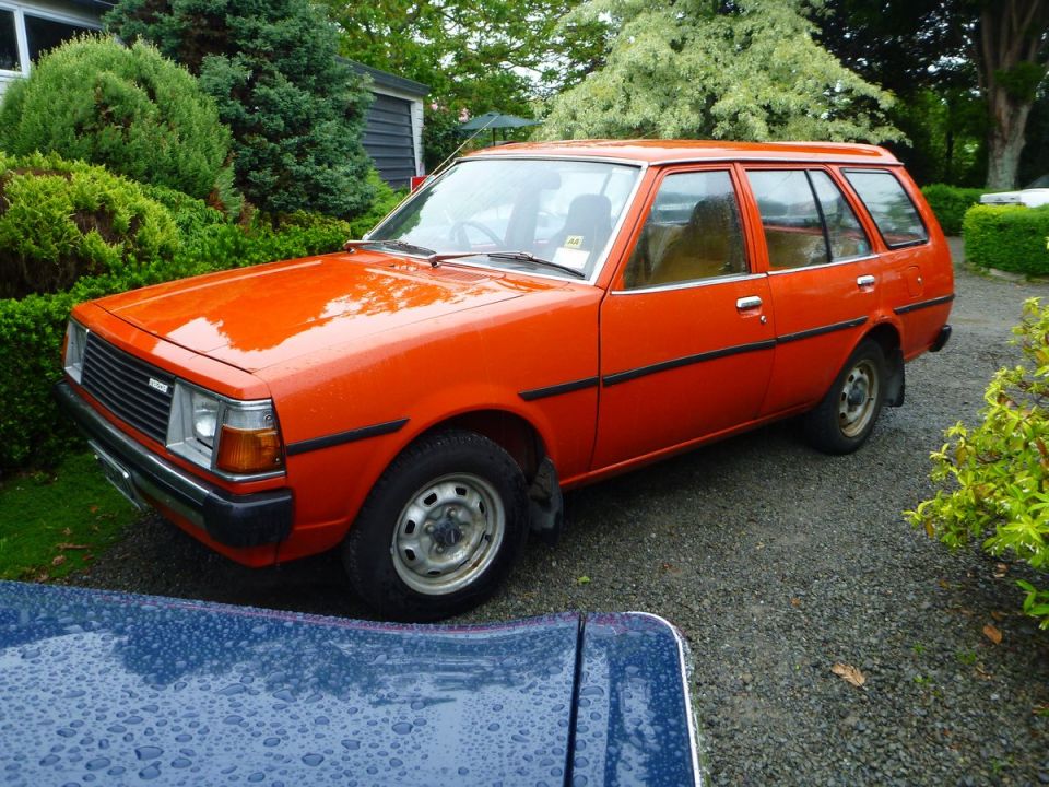 Orange station wagon, 3/4 front view