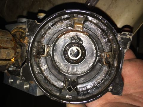 2011 Ford Elite - A greasy automotive part, possibly a power transfer unit component, is shown in a close-up view.