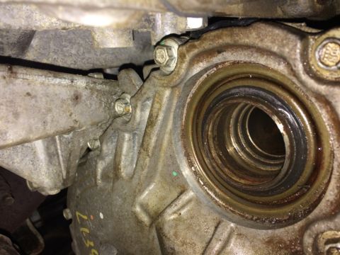 2011 Ford Elite - Close-up view of the Power Transfer Unit (PTU) intermediate shaft seal housing, showing signs of wear.