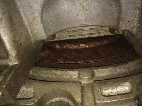 2011 Ford Elite - This image shows a close-up view of a rusty metal component, likely a seal or gasket, within the engine housing.