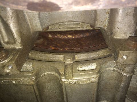 2011 Ford Elite - Underside view of vehicle drivetrain components, showing rust and wear.