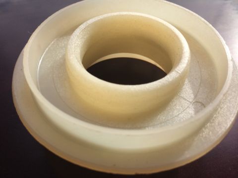 2011 Ford Elite - A plastic bushing, possibly for a vehicle's drivetrain, is shown in detail.