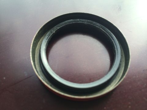 2011 Ford Elite - A seal with a metal casing is shown, likely a replacement part.