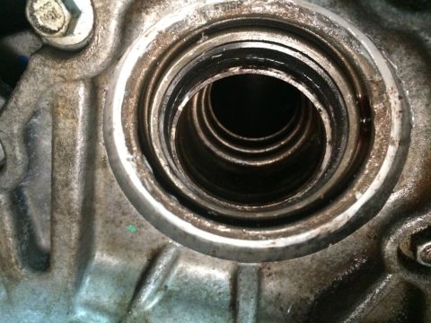 2011 Ford Elite - This is a close-up view of a mechanical component, likely part of a drivetrain, showing internal seals and a housing.