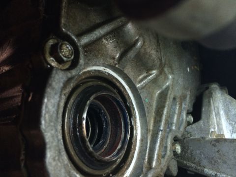 2011 Ford Elite - A close-up view of a transmission seal, likely needing replacement.