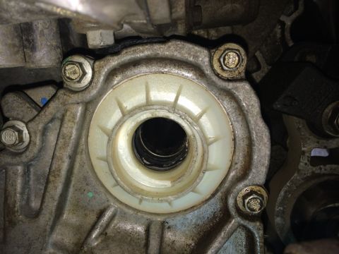 2011 Ford Elite - Engine component with a white seal and bolts, likely part of the PTU or intermediate shaft.