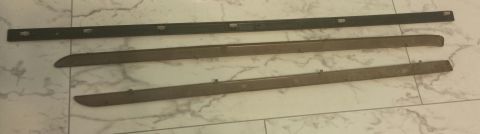 1995 Ford Bronco - Three automotive trim pieces are shown on a marble-patterned floor.