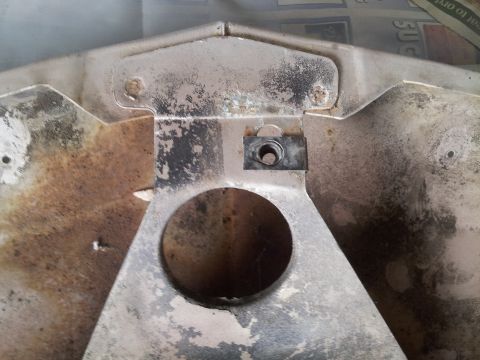 1976 Ford Ranchero - This close-up shows a metal component with a circular hole and a nut clip for mounting.