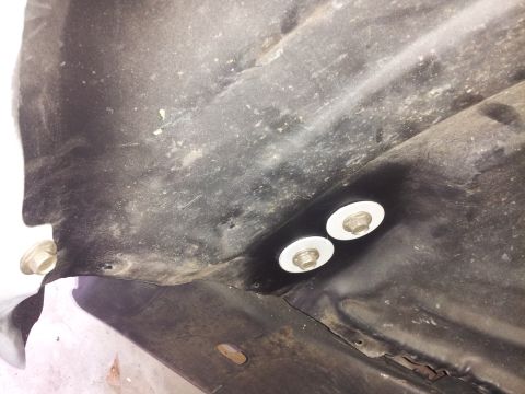 1976 Ford Ranchero - Close-up view of a vehicle part's underside, showing mounting hardware.