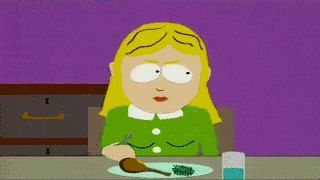 2000 Mercury Grand Marquis - A woman sits at a table, looking displeased while eating a small portion of green food.
