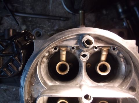 1979 Ford Ranchero - This is a close-up view of the internal components of a carburetor, likely from a 1979 Ford Ranchero. The image focuses on the venturi bore…