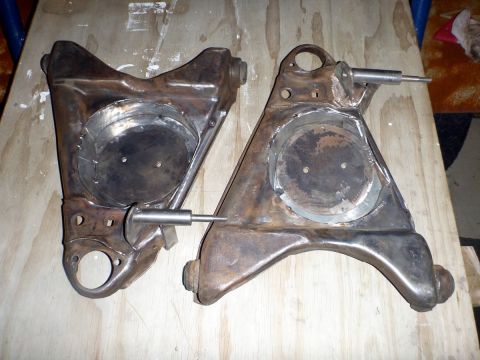 1964 Mercury Monterey - Pair of used suspension control arms shown, likely needing restoration.