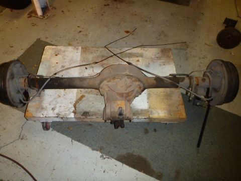1964 Mercury Monterey - This is a rear axle assembly with drum brakes and brake lines, shown on a pallet.