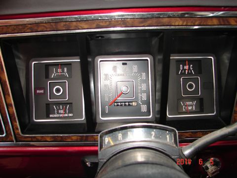 1979 Ford F-150 - The interior dashboard of a vintage Ford F-150 pickup truck displays the fuel gauge, oil pressure gauge, and temperature gauge. The odomete…