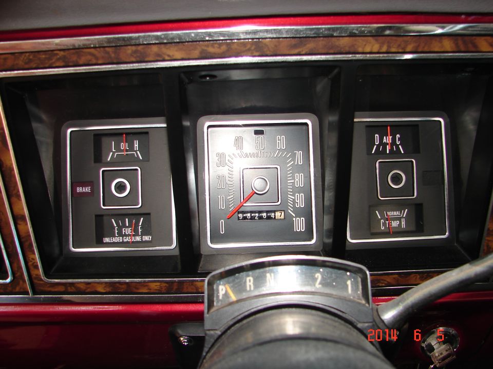 Vintage Ford F-150 dashboard with fuel, oil, and temp gauges, and odometer.