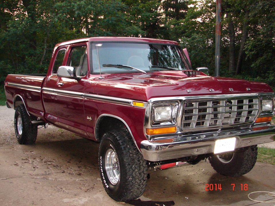 Maroon 1979 Ford F-150 pickup truck, 3/4 front view, parked outdoors.