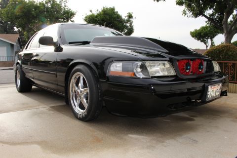 2003 Ford Crown Victoria - Photograph of a black Mercury Marauder sedan, not a technical document.