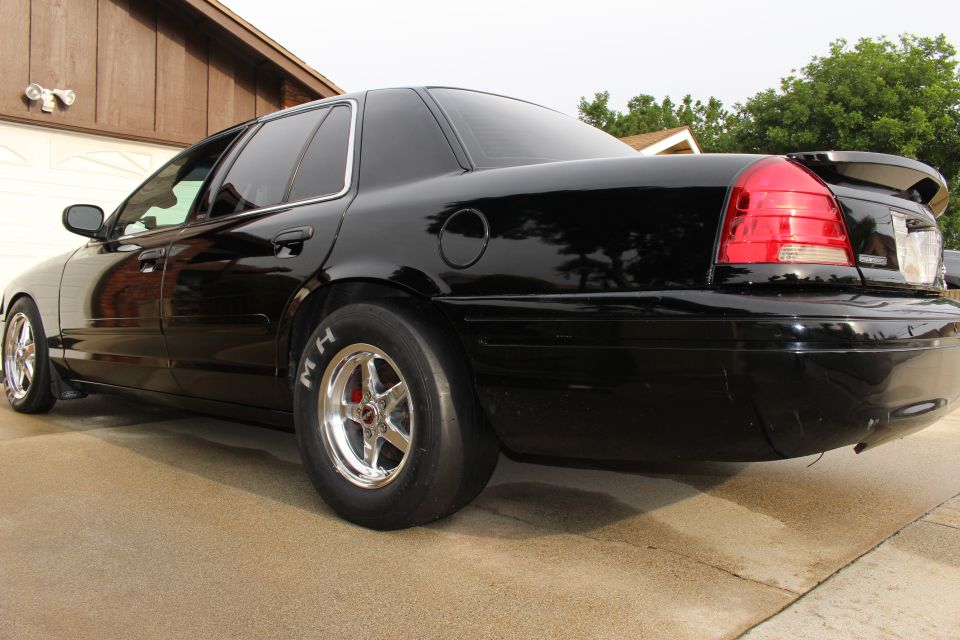 Black Crown Victoria rear quarter with M/H drag tire