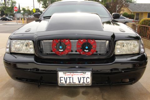 2003 Ford Crown Victoria - Front-end photo of a black Ford Crown Victoria with intercooler, red fans, and EVIL VIC plate.