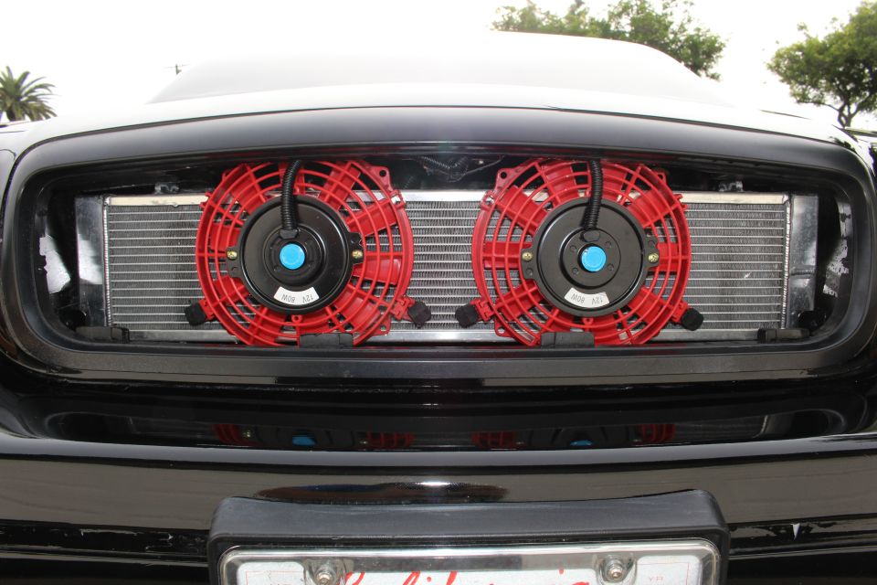 Closeup of intercooler and two red fans in Crown Victoria grille