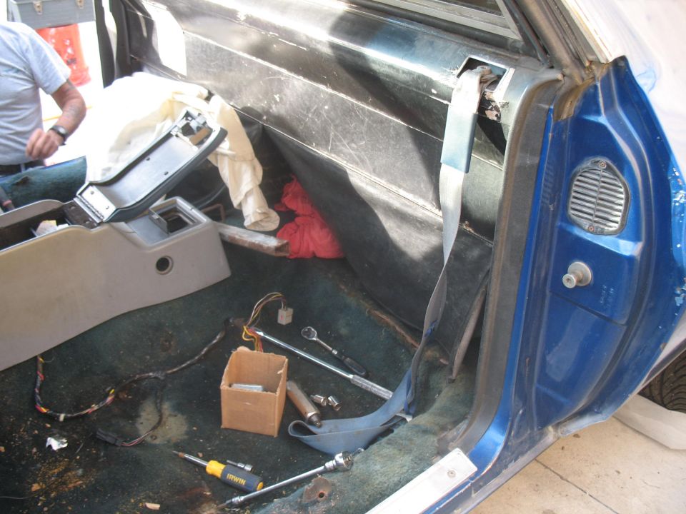 Close-up of a car's interior, showing dashboard and door panel details
