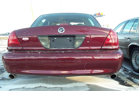 2001 Ford Crown Victoria - The rear of a Mercury Marauder is shown parked in a lot with snow on the ground.