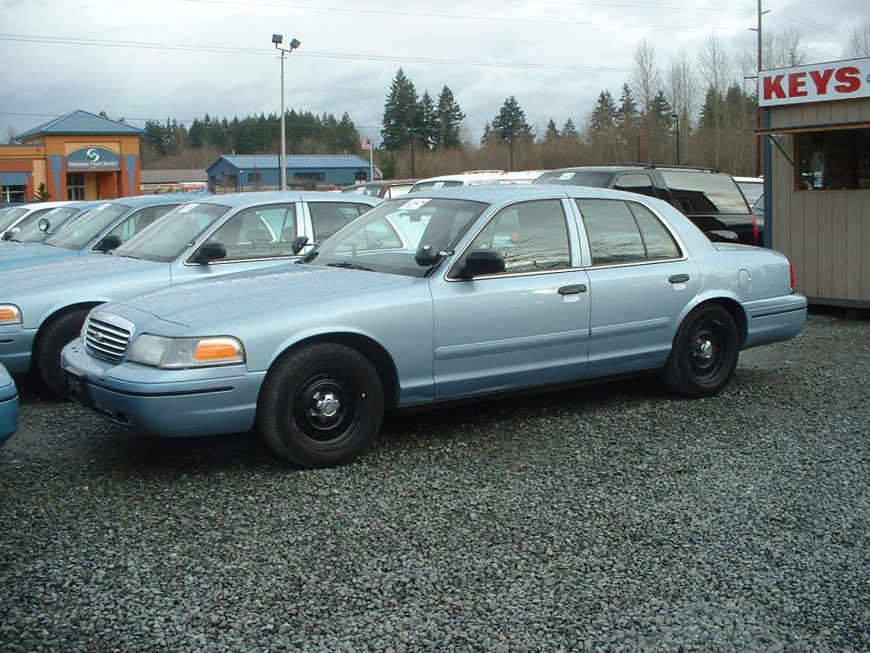 Retired '99 Seattle Police Crown Vic. Has 85K miles. Note the color change. Someone accidently ordered the wrong color for the '99 Crown Victorias. Also note the chrome grille. Every '99 to current Seattle Police Crown Vic have chrome grilles. Less "agressive" they say.