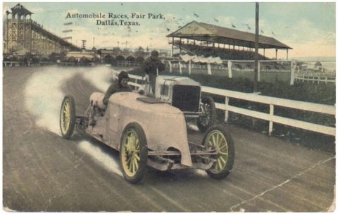 1909 Ford Model T - Vintage race cars compete at Fair Park in Dallas, Texas, with grandstands visible in the background.