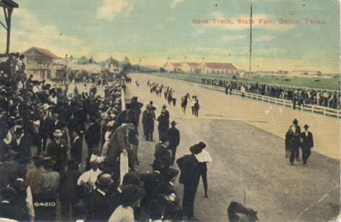 1909 Ford Model T - Spectators gather to watch a horse race at the State Fair in Dallas, Texas.