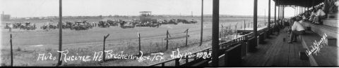 1909 Ford Model T - Auto racing event at Breckenridge, Texas, on July 13-19, 1936, showing cars on the track and spectators.