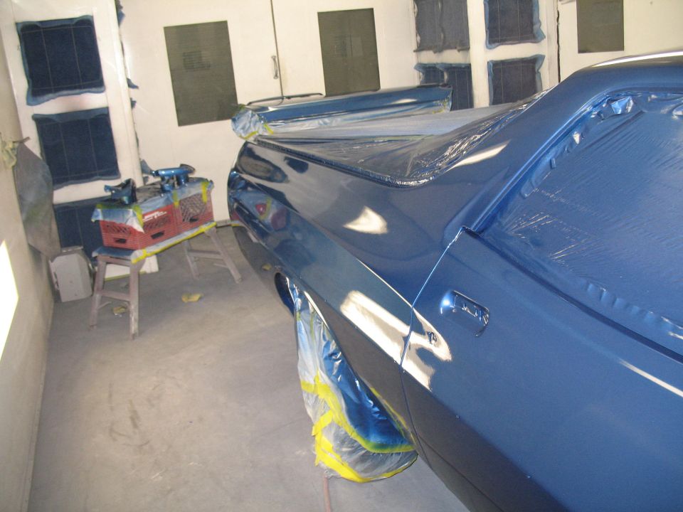 Blue 1972 Ford Ranchero rear quarter panel and bed in paint booth