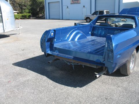 1972 Ford Ranchero - Rear view of a blue 1972 Ford Ranchero, possibly undergoing paint and body work.