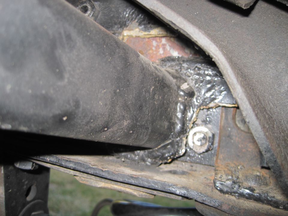 Close-up of a welded frame component with a bolt