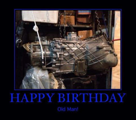 1994 Ford Bronco - A vehicle transmission is shown hanging in a garage, with a birthday message below.