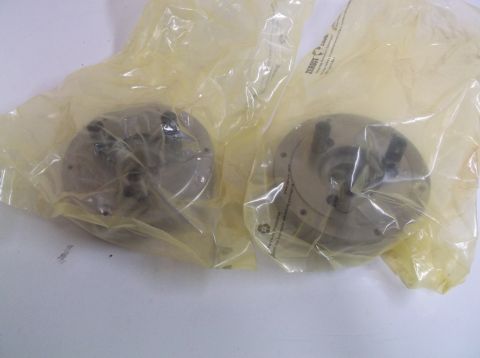 1995 Mercury Grand Marquis - Two chucks are shown in their original plastic packaging.