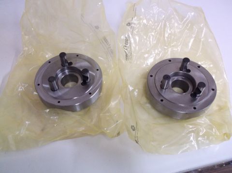 1995 Mercury Grand Marquis - Two metal chucks, likely for a lathe, are shown in their original plastic packaging. The "SUPERMOTORS" watermark is visible.