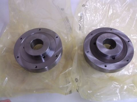 1995 Mercury Grand Marquis - Two metal automotive parts are shown in protective plastic packaging, with a Supermotors logo visible.