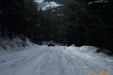 1995 Ford Bronco - Brother Scott's big Dodge heading up the hill.