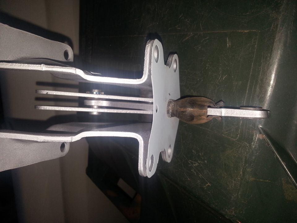close-up of a parking brake lever mechanism with a wooden handle