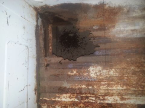 1973 Ford F-100 - Significant rust and damage are visible in the corner of this truck bed.