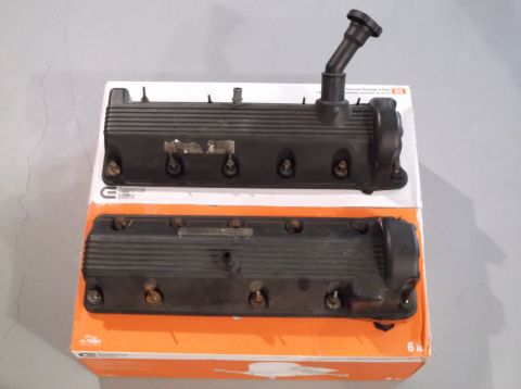 1995 Mercury Grand Marquis - Two engine valve covers are shown, one with a black hose fitting attached.