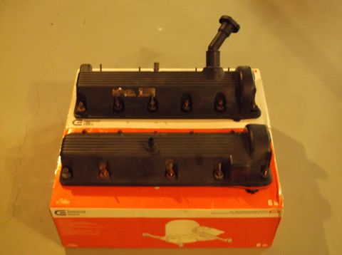 1995 Mercury Grand Marquis - A pair of engine valve covers are displayed on top of a cardboard box.