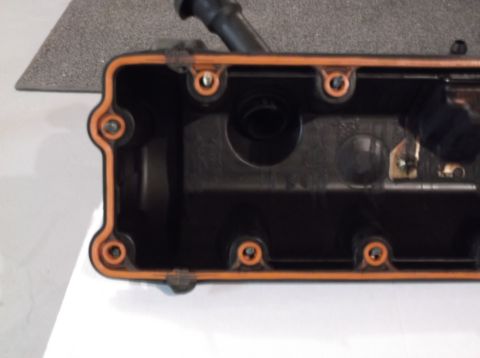 1995 Mercury Grand Marquis - This is a close-up view of an engine valve cover, showing its internal components and gasket.