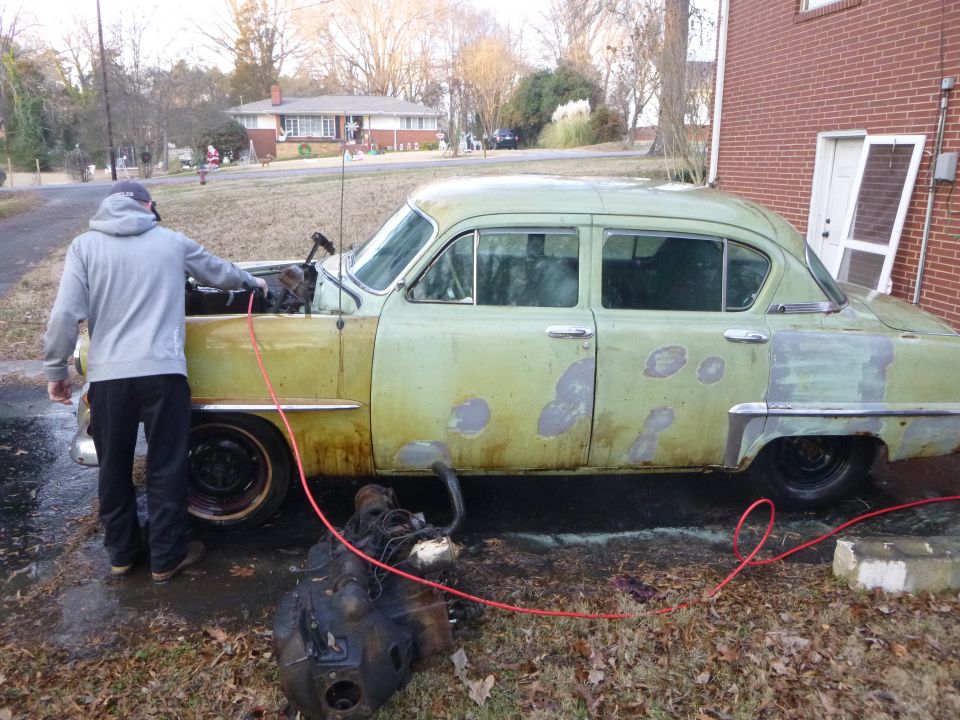 1953 Plymouth Belvedere sedan, side view, pale green with primer patches