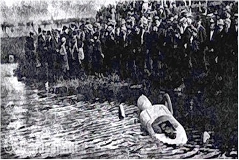 Person in water, crowd watching