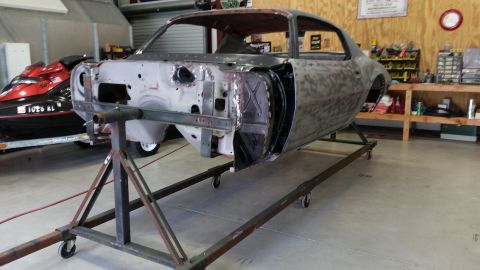 1970 Pontiac Trans Am - This car body is undergoing restoration work in a garage, with a jet ski visible in the background.