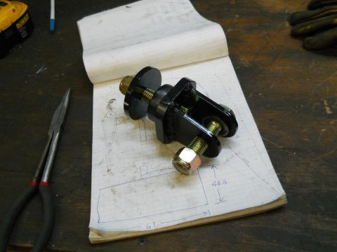 1992 Ford Bronco - A mechanical part is shown on a notebook with a diagram and measurements.