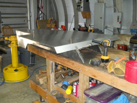 1992 Ford Bronco - A metal fabrication project is underway in a workshop, with various tools and equipment visible.