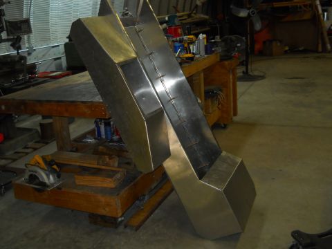 1992 Ford Bronco - A custom metal fabrication project is shown on a workbench in a workshop setting.